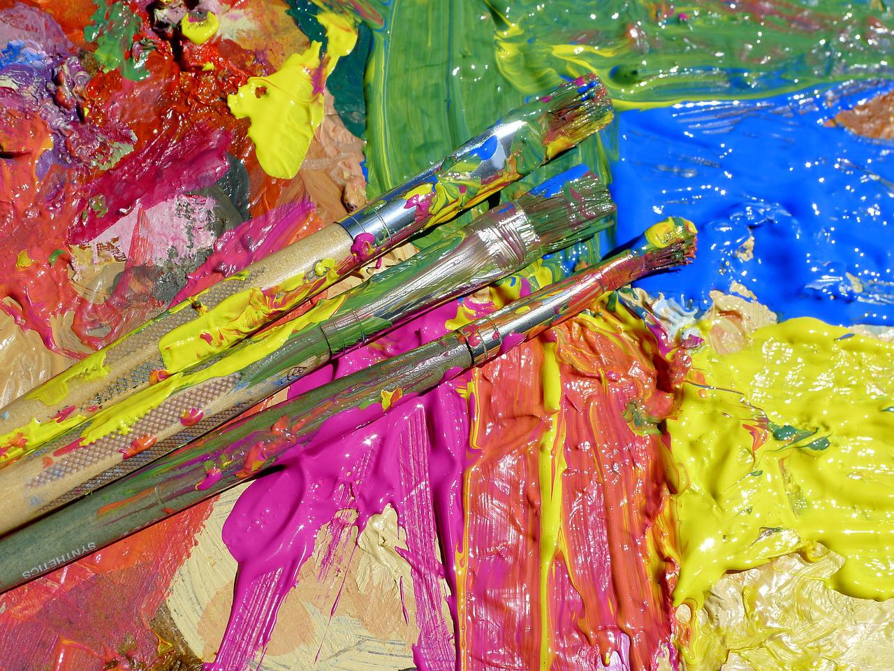 Paint brushes and paint in various colors