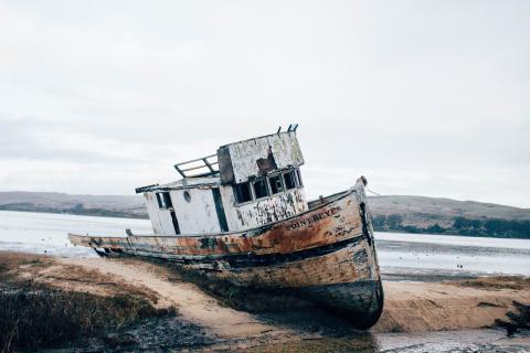 Picture of shipwreck on sand.