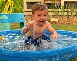 baby enjoying pool