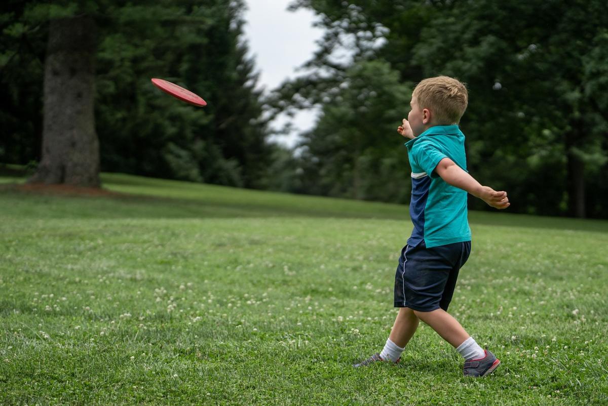 Boy throwing Frisbee