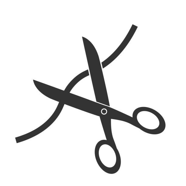 A pair of scissors ready to snip a cable cord