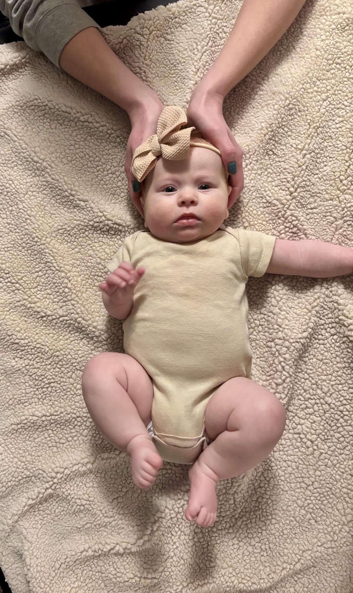 Infant being massaged